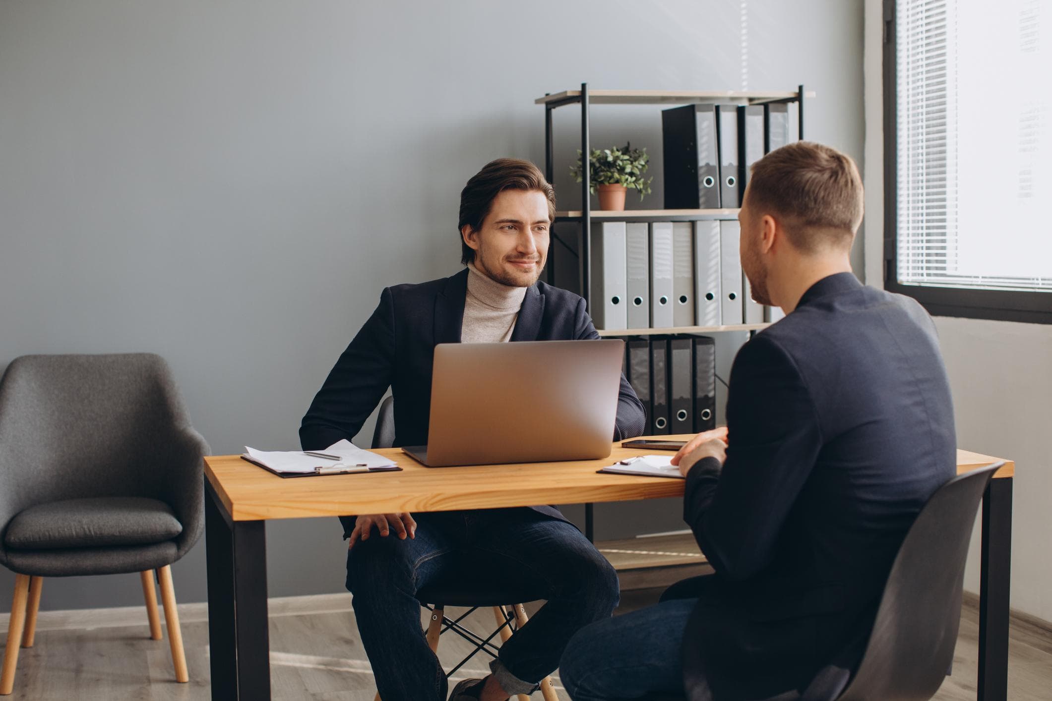 Recruitment consultants meeting a candidate in a Dubai office